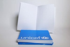 S4410020 Book, exercise, A5, 5mm-square, 48 pages, packs of 20 Technical Specifications: Exercise book, size A5 (210mm long x 148mm wide), white wood free paper of 70gsm suitable for both pen and pencil, 24 sheets/48 pages. Pages printed with 5mm squares. Lines are clearly, cleanly and consistently printed. Cover: Glossy finish, 140gsm offset paper, securely saddle-stitched with 2 stainless staples through the cover on long (210mm) side. Colour: Cyan blue uniformly printed using food-grade dye, with UNICEF logo printed in white on the front cover and down the free side of the back cover. The composition of the paper, design, and the method of attachment make the exercise book suitable for the safe and extended use by children. Packaging & Labelling: Plastic wrapped pack of 20 Weight/Volume/Dimensions: Estimated weight: 1.386kg Estimated volume: 2.44cdm Instructions for use: For classroom use Part of the School in a box kit (SIB) School-in-a-Box