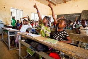 Safiatou Sanogo (in yellow-green dress) is a sixth grade student at Sokoroni A Public Primary School. If she successfully finishes school this year, she will be the first of the 16 children in her family to complete primary school. Whereas just ten years ago it was unlikely that girls like Safiatou would have been in school, today, thanks in large part to UNICEF's advocacy, many more girls are in school in Burkina Fasoand family's hopes are pinned not just on their sons', but also on their daughters' success. "Im glad that I am going to school," says Safiatou. "Those who dont get to attend school usually have to just work in the field with their parents. I think its better to go to school because if you do, then one day you can get a job and help your family."