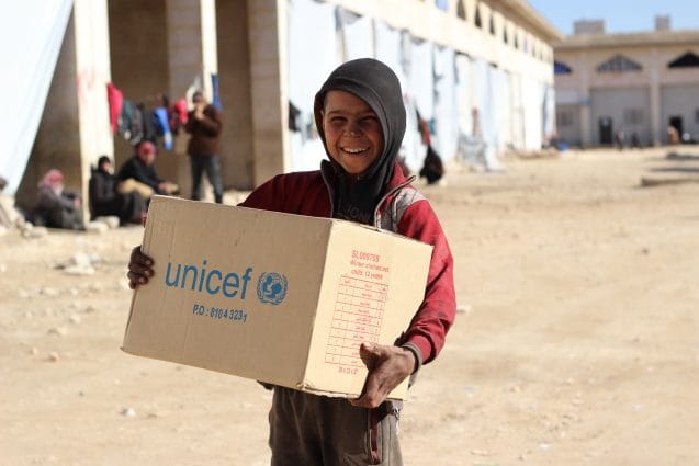 On 12 December 2016, Ahmed gives a radiant smile as he finds out that the clothes he was given were exactly his size. Over 5,000 children recently displaced from eastern Aleppo city have received winter clothes provided by UNICEF. Displaced children like Ahmed are especially vulnerable at this time of year. As temperatures drop, children are at risk of hypothermia, pneumonia and other deadly diseases. With both parents dead and no other relatives to look after him or his four siblings, Ahmed came to the shelter from East Aleppo with neighbors. Winter is the latest threat to children in conflict-ridden Aleppo. As people continue to flee the besieged Syrian city of Aleppo, UNICEF is working to reach displaced families with the supplies they need to survive the brutal winter. Some children have lost or become separated from their families, leaving them even more vulnerable. Five days ago, 10-year-old Ahmed arrived in Jibreen, an industrial district on the outskirts of Aleppo. Ahmeds parents were killed in the vicious conflict engulfing the city. He and his four siblings have nobody to take care of them and help keep them warm. The journey to Jibreen was gruelling for five-year-old Rahaf, her two-year-old brother Wael, and their mother, who fled their home in east Aleppo. Their mother, a widow who suffered a shrapnel wound on her leg, had to wheel her children for hours until they could be transported by bus to the Jibreen shelter.